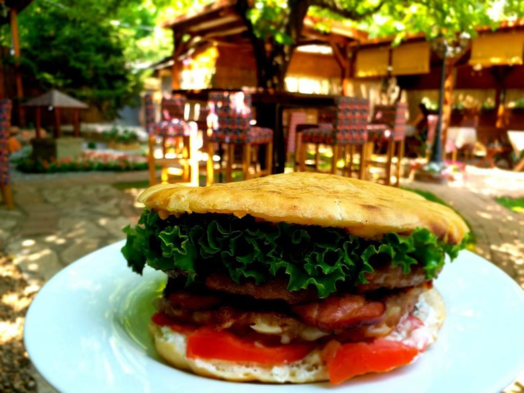 A traditional Serbian pljeskavica, a delicious counterpoint in the global hamburger history.